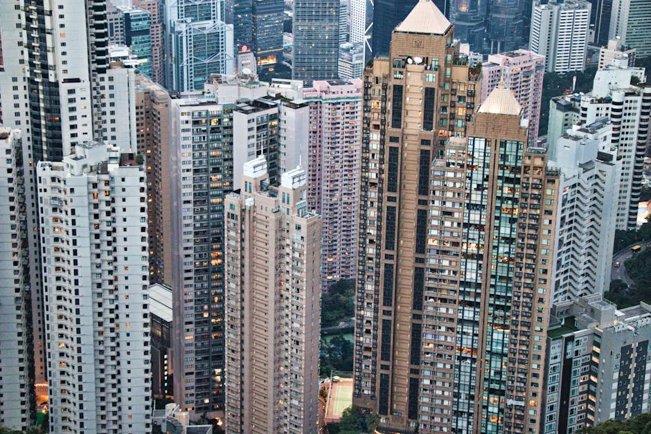 Panoramic view of towering skyscrapers on Hong Kong Island. Urban architecture captured from above.
