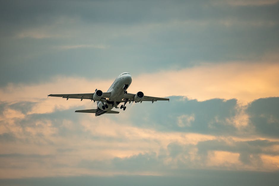 Airplane takes off against a dramatic sky at Munich Airport, Germany.